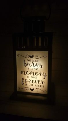 a lighted sign that reads, this candle burns in loving memory of those our hearts