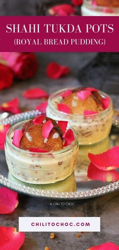 two small bowls filled with food sitting on top of a metal tray next to flowers