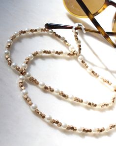 more sunglasses chain in DearDanielleJewelry: https://www.etsy.com/shop/DearDanielleJewelry?ref=seller-platform-mcnav§ion_id=28433527 Pearl and Gold beads glasses chain. Boho Glasses chain. Sophisticated subtle sunglasses chain necklace *Gold plated beads. fresh water pearl *jewelry in my shop will be sent in cotton pouch. **If you want gift box wrapped, please let us know we will send your jewelry in gift box. Boho Glasses, Beads Glasses, Chain For Glasses, Pearl Glasses, Pearl Mask, Glasses Mask, Strap Masker, Beaded Sunglasses, Wood Hoop Earrings