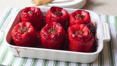 red peppers in a white dish on a table