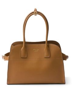 Prada Medium Leather Tote Bag - Farfetch Brown Briefcase With Gold-tone Hardware For Work, Brown Briefcase With Gold-tone Hardware For Office, Brown Satchel Briefcase With Gold-tone Hardware, Brown Satchel With Gold-tone Hardware For Work, Brown Workwear Satchel With Gold-tone Hardware, Classic Gold Satchel For Workwear, Brown Office Briefcase With Handles, Brown Office Briefcase, Modern Brown Briefcase With Gold-tone Hardware