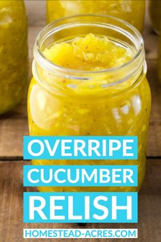 a jar filled with yellow cucumber relish sitting on top of a wooden table