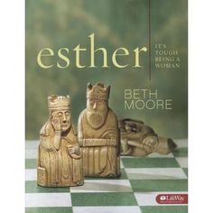 a book cover with two wooden figures on a checkered floor and the title,'esther tools to build a woman '