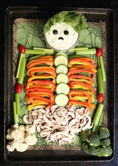 a skeleton made out of carrots, celery and mushrooms