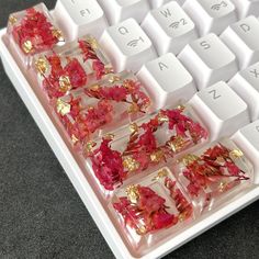 red and gold flowers are placed on the keyboard