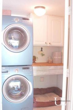 a washer and dryer in a laundry room with the door ajar open