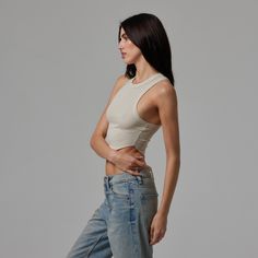 Not your average tank. Introducing the Scallop Tank. Cut from ultra-lightweight modal rib for the most comfortable fit and feel yet. Featuring a curved hem and racer back, this is the tank you're missing. 96% Modal, 4% Spandex Form Fitting Soft Ribbed Texture Crop Length Raw-Hem Scallop Hemline Racerback Shape Everyday Seamless Racerback Crop Top, Stretchy Tank Top For Spring, Versatile Everyday Tank Top With Seamless Construction, Versatile Seamless Tank Top For Everyday, Trendy Seamless Racerback Tank Top, Summer Racerback Crop Top For Everyday, Seamless Sleeveless Tank Top, Everyday Summer Racerback Crop Top, High Stretch Seamless Tank Top For Everyday