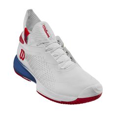 a white tennis shoe with red and blue accents on the upper part of the shoe