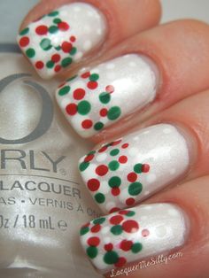 Cute & Easy Free hand, Christmas Nail Art Pearl white nails with French Manicure style tips of red & green layered dots. Layering is done by applying multiple layers of clear coat with just a few of the dots done on each layer to give the dots dimension. A word of caution- multiple layers of any clear coat will easily peel off natural nails so this design (as it's shown) is best suited for a processed nail i.e. acrylic, gel, overlay, wrap etc. Christmas Nail Designs, Nail It, Christmas Nail, Creative Nails