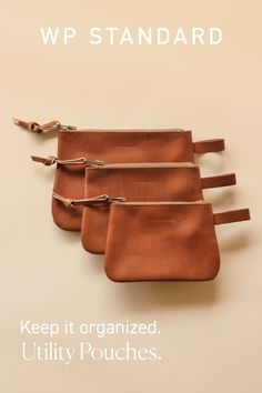 three leather pouches with zippers on each side and the words, keep it organized utility pouches