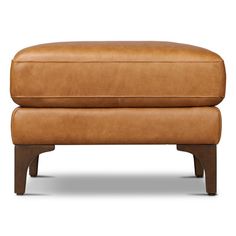 Elevate your space with the versatile Rava ottoman. Clad in full-grain Italian leather, it's more than an ottoman—it's a conversation starter. A sturdy wood frame ensures longevity, while its unique vintage patina adds character over time. With solid wood legs in a walnut finish, it doubles as a sophisticated coffee table, embodying timeless elegance. Rocci Leather Ottoman in Brown;cognac Tan | Size 19" H X 25.5" W X 25.5" D | AllModern Poufs & Ottomans, Ottoman In Living Room, Leather Ottoman, Sorrento, Walnut Finish, Modern Outdoor, All Modern, Wood Legs, Italian Leather