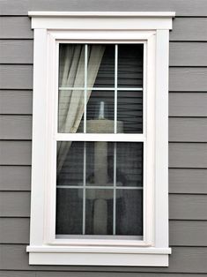 an open window on the side of a house