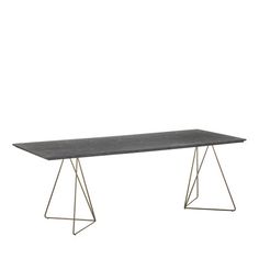 a black table sitting on top of a metal frame base with a white wall in the background