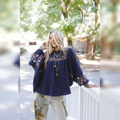 All of your boho dreams have come true with the Quinnlan Embroidered Tunic. You're going to love pairing this with all of your favorite bottoms! Lightweight Cotton gauze fabric Relaxed, loose and flowy silhouette with slight high - low bottom edge (perfect for your leggings!) Flattering round neckline and dropped shoulders and ruched center front panel Loose and long Dolman sleeves with elastic cinched cuffs So pretty floral embroidery details throughout for added boho style Pair with: Eye Of The Sun Padded Bralette, Pacific Distressed Wide Leg Jeans and Dreamscape Layered Necklace. *Due to lighting and differences in monitors, actual colors may vary slightly from what appears online. Model is 5'8" and wearing a size Small. Approximate measurements are as follows: SMALL: Bust: 76", Waist: Bohemian Embroidered Top With Boho Collar For Spring, Spring Bohemian Embroidered Top, Bohemian Embroidered Relaxed Fit Blouse, Bohemian Summer Peasant Top With Embroidered Sleeves, Bohemian Peasant Top With Embroidered Sleeves For Summer, Bohemian Embroidered Peasant Top For Spring, Bohemian Embroidered Peasant Top For Fall, Bohemian Embroidered Top For Spring Festival, Bohemian Peasant Top With Multicolor Embroidery