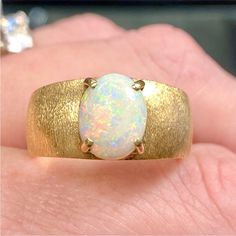 14k Yellow Gold Genuine Opal Thick Dome Ring Vintage Estate Solid 14k Yellow Gold Genuine Natural Opal Brushed (Textured) Dome Band Size - 8.5 Professionally Cleaned, Buffed, And Polished Gift Box Included October Birthstone Weight - 8.45 Grams Absolutely Stunning Cabochon Cut Oval Genuine Opal On A Thick, Brushed 14k Yellow Gold Domed Band. Beautiful Flashes Of Color - True Opal (Not Doublet Or Triplet). Heavy, Well Made Ring With Brushed Textured Band. Dome Style Ring. Vintage Estate, Jewelry, Retro, 14k, Yellow Gold, Ring, Dome Band, Opal, Gem, Gemstone, October Birthstone, Real, Genuine, Natural, Real, Texture, Brushed, Engagement, Wedding, Birthday, Anniv Formal 14k Gold Polished Opal Ring, Formal 14k Gold Opal Ring With Polished Finish, Luxury 14k Gold Opal Ring For Anniversary, Luxury 14k White Gold Opal Ring, Formal 14k Gold Opal Ring, Elegant Wide Band Gemstone Jewelry, Formal Hallmarked Opal Ring In Fine Jewelry Style, Hallmarked Opal Ring Fine Jewelry For Formal Occasions, Hallmarked Opal Ring For Formal Occasions