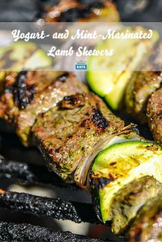 grilled meat and vegetables on a grill with the words yogurt and mint - marinated lamb skewers