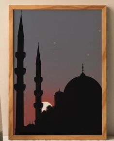 the silhouette of a mosque against a pink sky