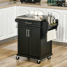 a kitchen island cart with two pots and pans on it