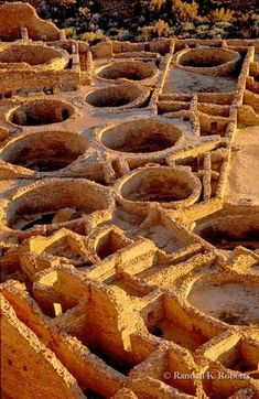 many clay pots are stacked on top of each other