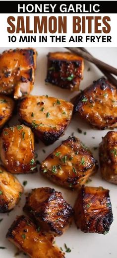 honey garlic salmon bites on a white plate with chopsticks