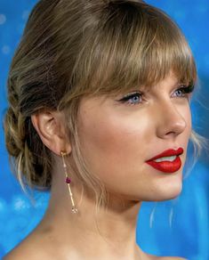 a close up of a person wearing red lipstick