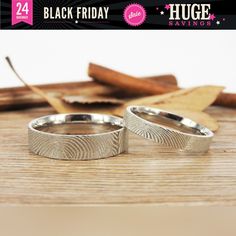 two wedding bands with finger prints on them