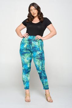 High waist leggings Wide waistband Soft and stretchy yoga fabric Pull on closure Made in USA Self: 91% Polyester 9% Spandex See care label for care instructions. Model is 5'11" and wears a 1X Leggings Wide, High Waist Leggings, White Zebra, Fashion Plus Size, Care Label, Wide Waistband, Tropical Leaves, Curvy Fashion, Yoga Leggings