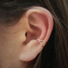 Up your style game with these sterling silver criss cross ear cuffs. Choose to keep it simple by wearing just one for a minimalist look, or get a little edgy by wearing two or more. It's like a party on your ear! Ear cuffs are perfect accents to your other earring choices for the day, and do not require any piercing. Just fit on your ear by gently pinching to the ear. Measurements approximately: Small - 7mm x 8mm x 9mmLarge - 9mm x 14mm x 15mm Ear Peircings, Minimalist Ear Cuff, Silver Ear Cuff, Monogram Jewelry, Ear Cuffs, Cross Earrings, Small Earrings, Cuff Earrings, Silver Cross