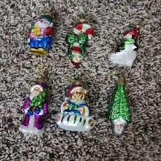 christmas ornaments are laying on the carpet next to each other