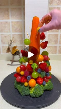 a video demonstrating how to make a fruit and vegetable pyramid