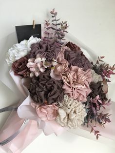 a bouquet of flowers sitting on top of a table next to a pair of scissors