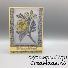 a yellow and gray card with flowers on it