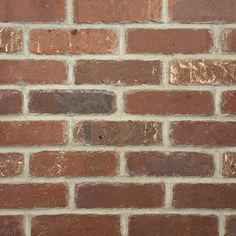 a close up of a brick wall with no mortars or mortars on it