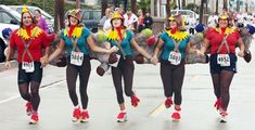 a group of people that are walking down the street with some shoes in front of them