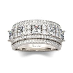 a white gold ring with three rows of diamonds