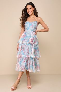 Springtime soirees just got a little sweeter now that the Lulus Darling Aesthetic Light Blue Floral Print Tiered Midi Dress is on the scene! Airy woven organza boasts a lush floral print as it shapes adjustable spaghetti straps and a bodice with surplice-inspired seaming that gives an overlapping effect. Fitted waist sits above a skirt that falls in floaty tiers to a midi hem. Hidden zipper/clasp at back. Fit: This garment fits true to size. Length: Mid-calf length. Size medium measures 46" from Aesthetic Light Blue, Organza Midi Dress, Organza Dresses, Aesthetic Light, Wedding Top, Casual Wedding Dress, Tiered Midi Dress, Blue Floral Print, Floral Print Dress