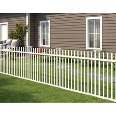 a white picket fence in front of a house