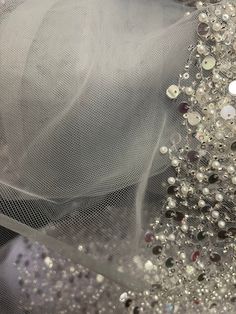 the veil is covered with beads and sequins