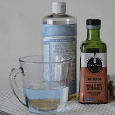 the ingredients to make an apple cider are displayed on a white towel with a glass mug