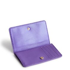 Keep your essentials in style with this elegant card case, designed for the modern individual who values both form and function. Slim yet spacious, this case offers secure storage for your cards while maintaining a sleek profile. Perfect for slipping into your pocket or bag, it’s the ultimate accessory for staying organized on the go. Crafted with meticulous attention to detail, this card case adds a touch of sophistication to your everyday routine. Vera Bradley Card Case in Purple Chic Rectangular Card Holder With Card Slots, Trendy Rfid Blocking Card Holder For Daily Use, Elegant Card Holder With Card Slots For Daily Use, Chic Rectangular Card Holder For Gift, Elegant Card Holder For Daily Use With Card Slots, Chic Rectangular Card Holder, Elegant Card Holder For Daily Use, Elegant Bifold Card Holder With Card Slots, Elegant Daily Use Card Holder With Card Slots