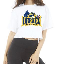 This super flattering Drexel White Cropped Tee is perfect for college game day or work from home! Our Drexel Cropped Tee's soft fabric makes it the most comfortable t-shirt to wear anytime. Go Dragons! 100% Cotton. Fits true to size. Cropped right above waist line. Modeled in a Size Small. Officially Licensed by Lo + Jo Bands. College Game Day, Cropped White Tee, College Games, College Game Days, Paddys Day, Cropped Tee, White Crop, Work From Home, Crop Tee