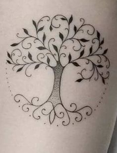 a small tree tattoo on the thigh