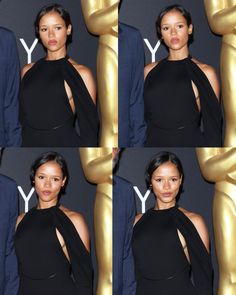 four pictures of a woman in black dress posing with her arm around an oscar statue