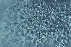 water ripples over the surface of a pool