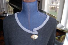 a mannequin with a necklace on it's neck