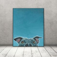 a painting of a dog's face is shown in front of a blue background