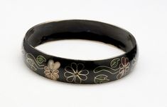 "Vintage Cloisonne Enameled Bangle Bracelet -Black background with floral motif -Dark reds, pinks, and greens make up this fine enamel work -Interior circumference 8.2\" -Width: .6\" -Very good vintage condition, a little wear to the enamel on the inside edges, otherwise a very nice bangle" Black Enamel Bracelet Jewelry, Black Enamel Bangle Bracelet, Black Enamel Bracelet Gift, Black Enamel Bracelets Gift, Black Enamel Bracelets For Gifts, Vintage Black Hand Painted Jewelry, Vintage Black Hand-painted Jewelry, Bracelet Flowers, Enamel Bangle