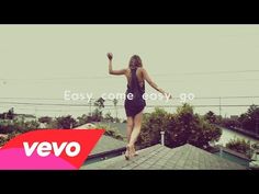 a woman standing on top of a roof with the words easy come easy go above her