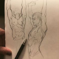 a person holding a pen in their hand next to a drawing of a man's torso