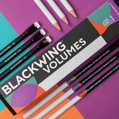 the blackwings are lined up next to each other with pencils in them